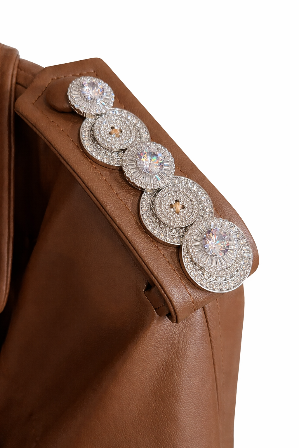 Veins of Gold – Caramel Leather Crystal-Detail Trench
A modern Atelier Hekayat statement piece that blends structured tailoring with refined luxury.